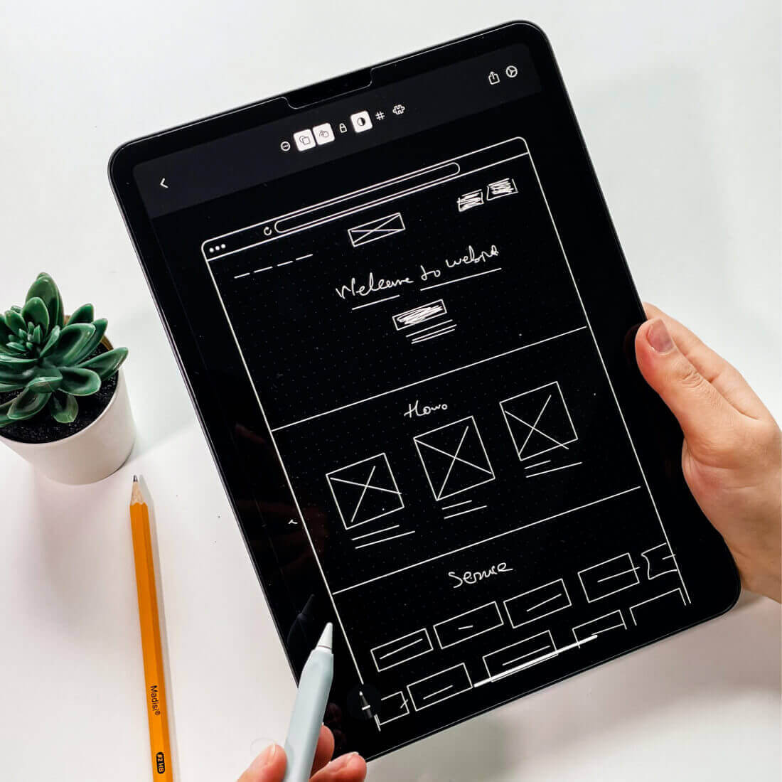 Tablet screen with a conceptual sketch of a website idea
